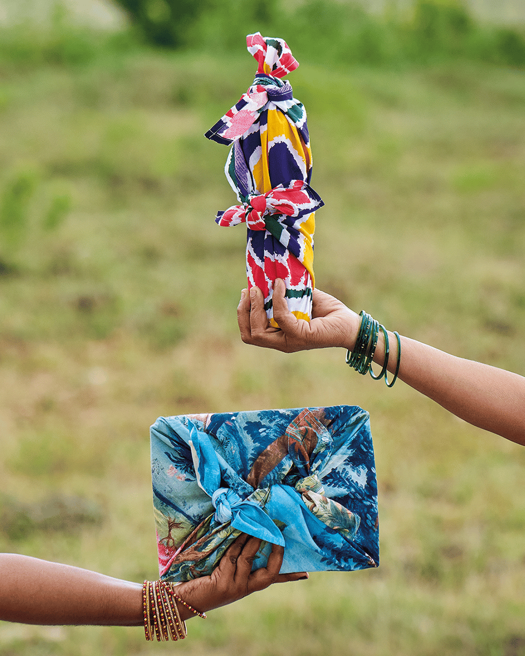 Hands holding wrapped gifts