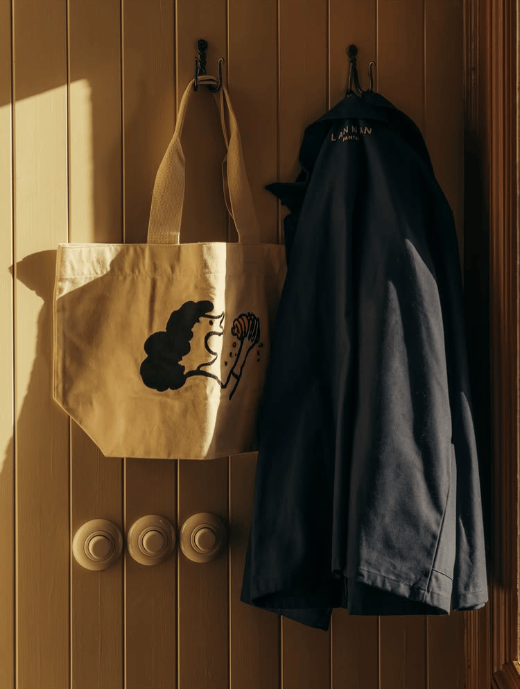 Lannan Tote hanging on peg
