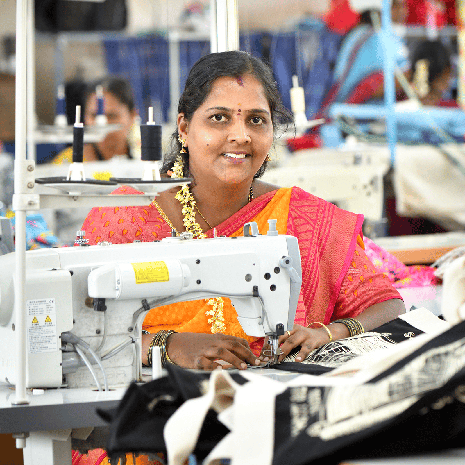 Artisan Geeta sewing at machine