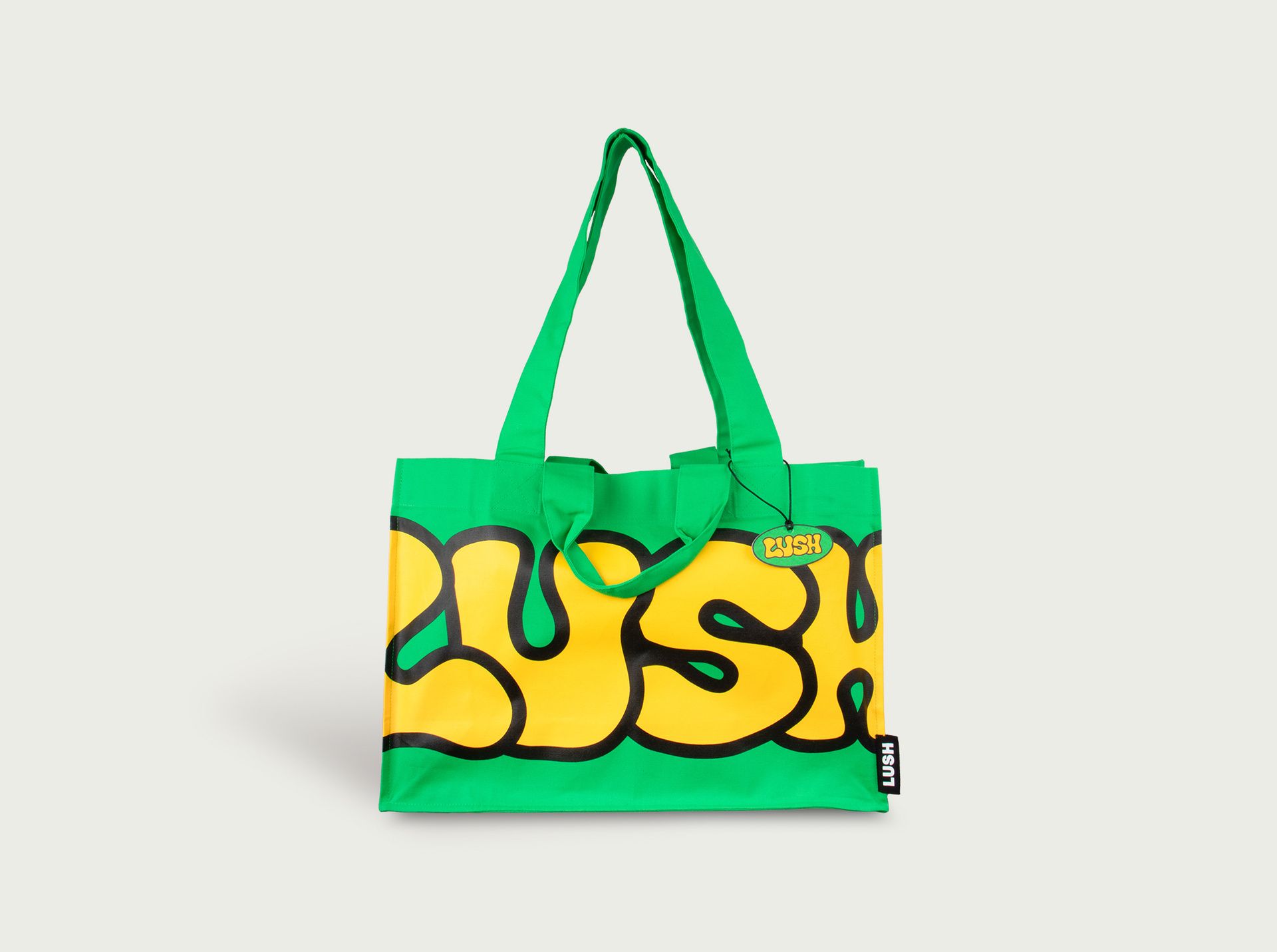 Double handled green LUSH bag