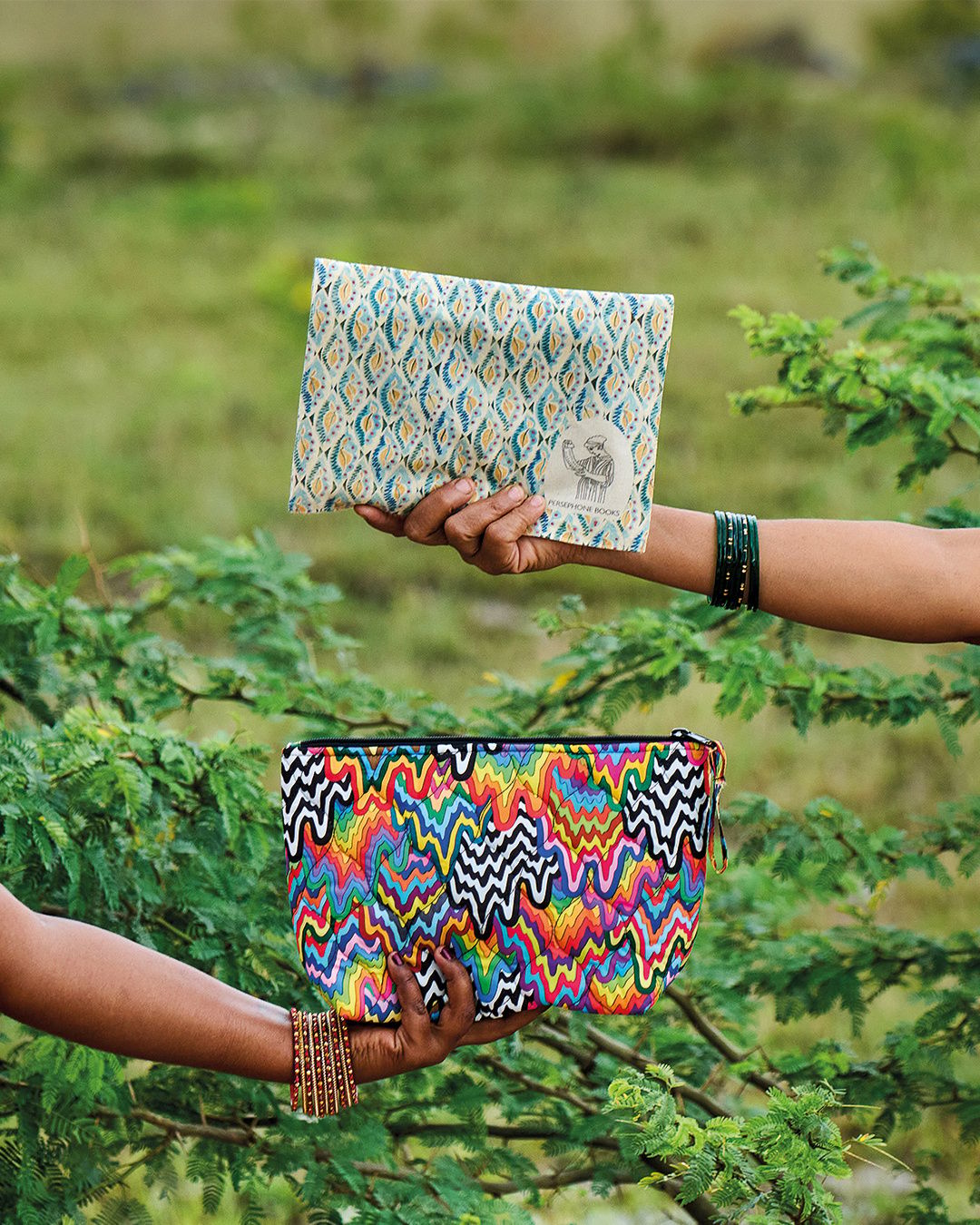 Hands holding pouches