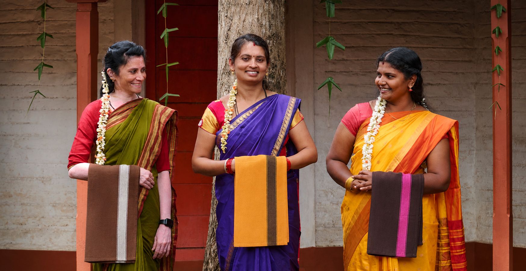 Women holding tea towels