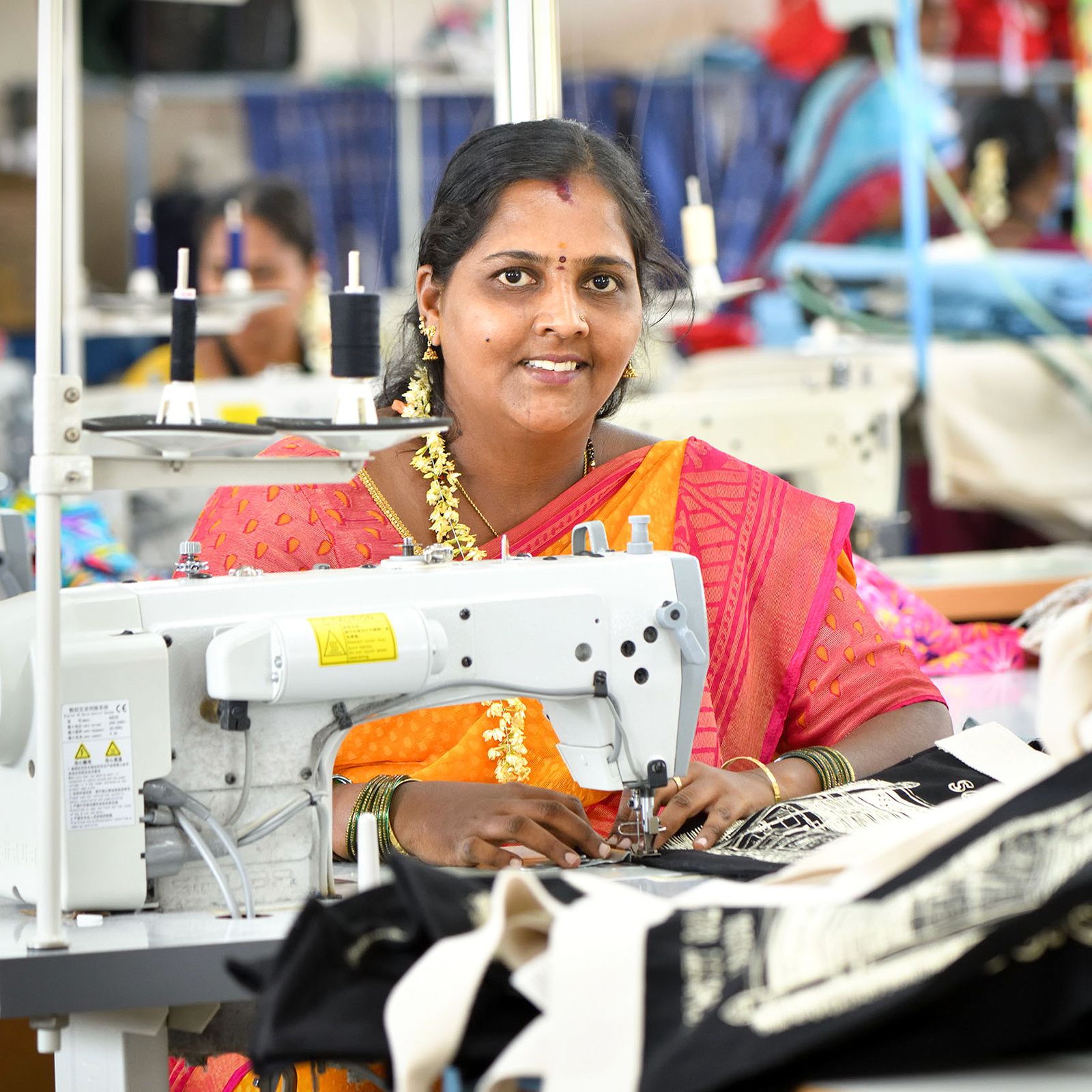 Artisan Geeta sewing at machine