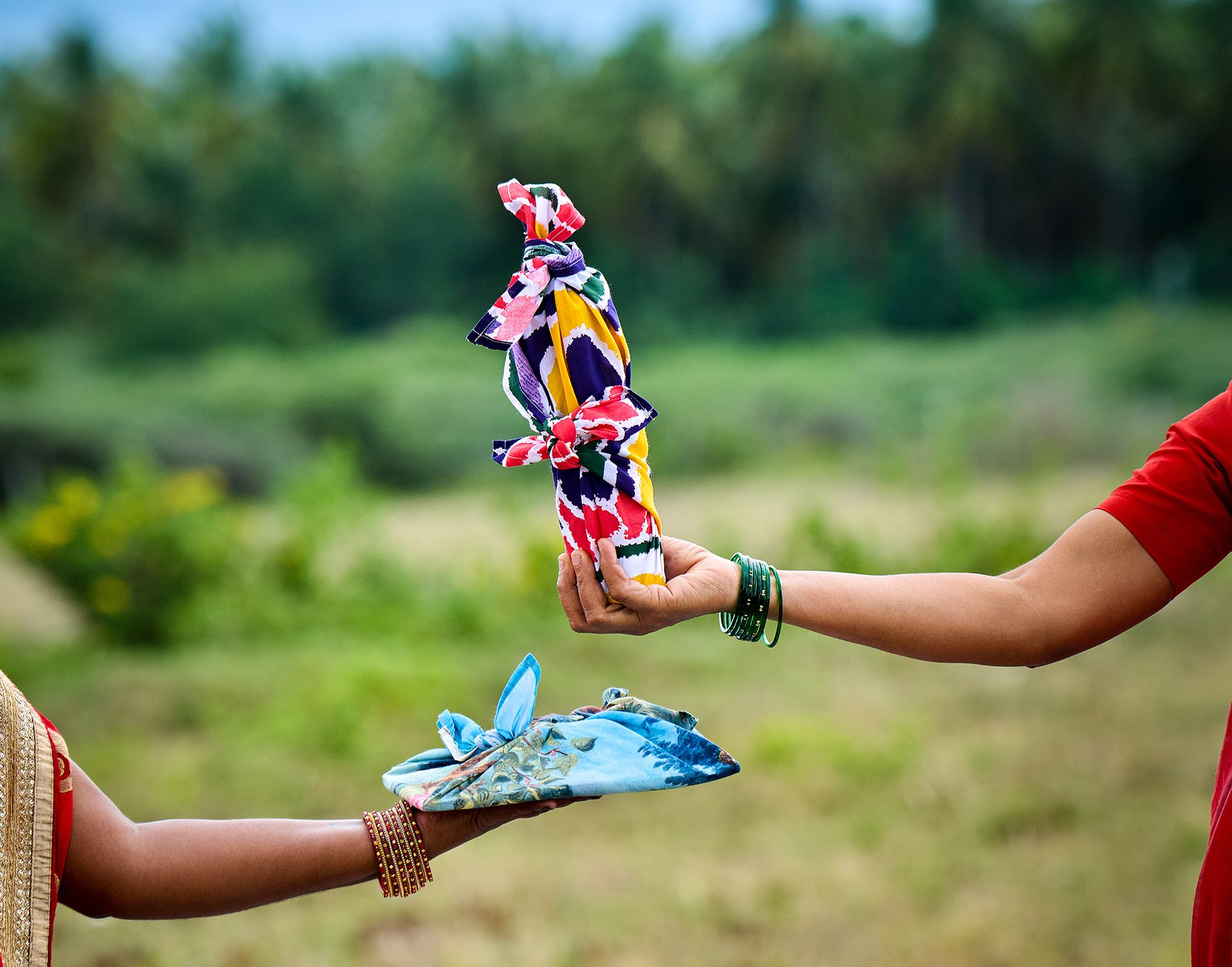 Hands holding fabric wraps