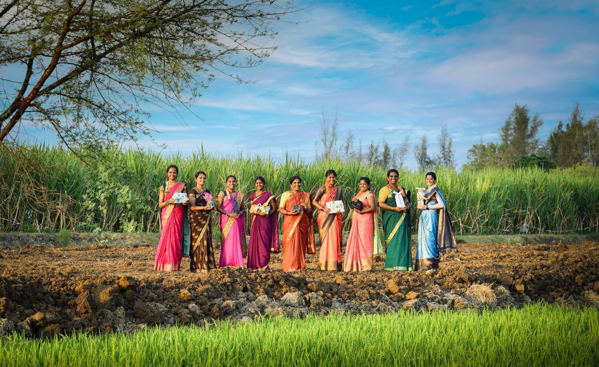 Women in field with gifts