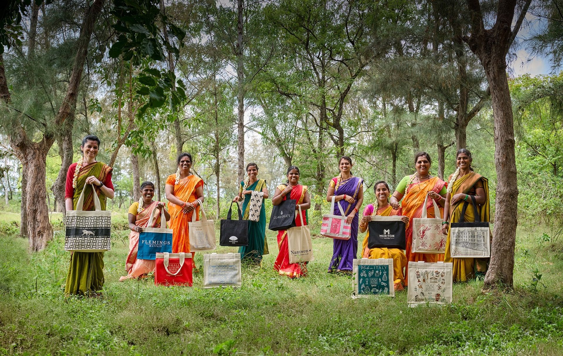 Women in forest with tote bags