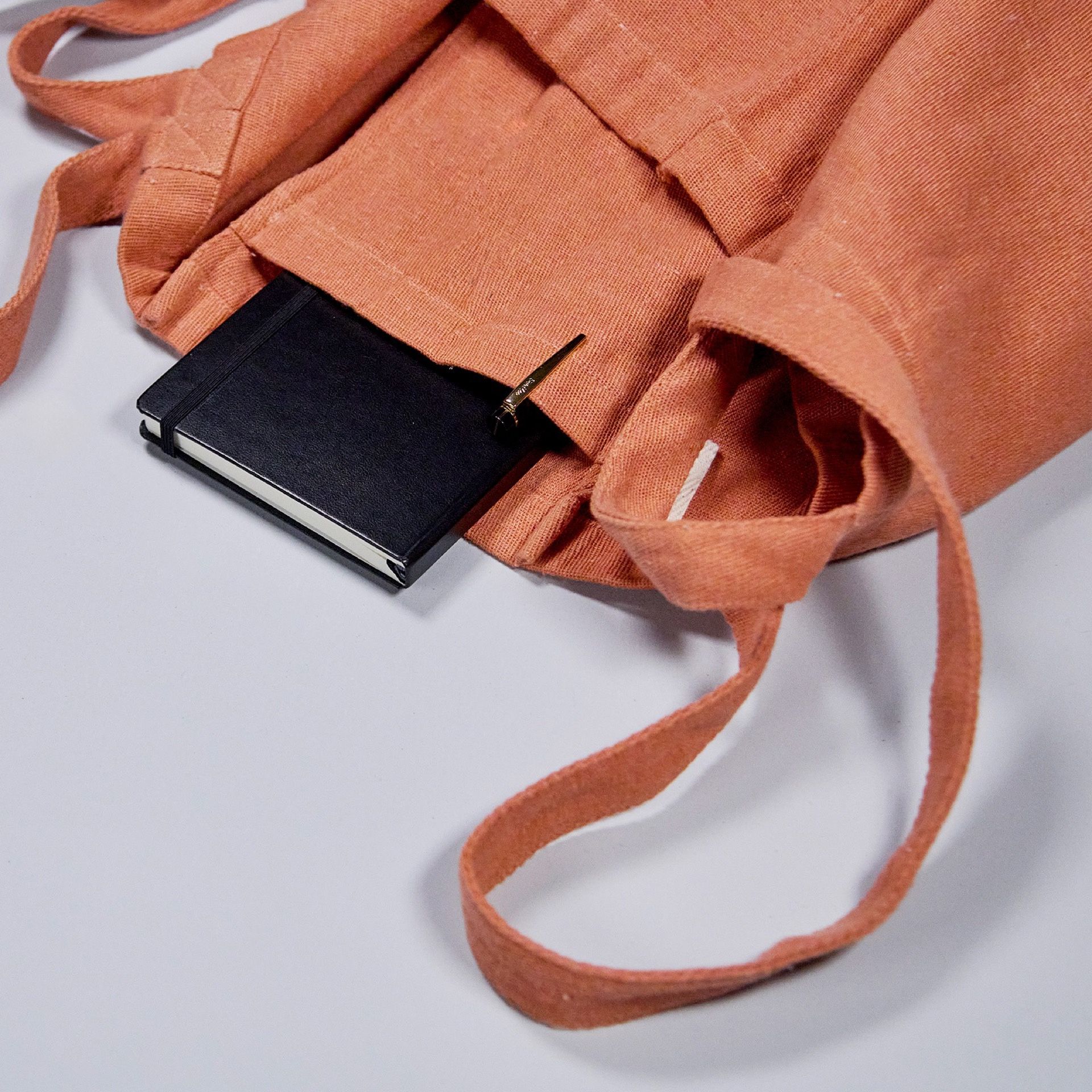Bag interior with notebook and pen